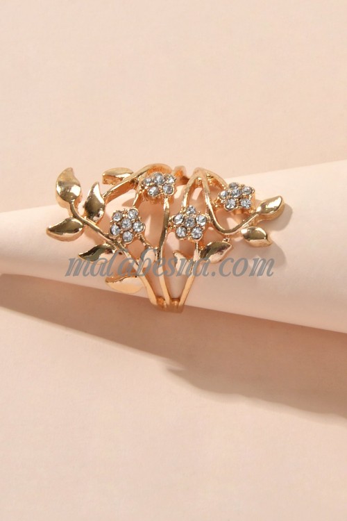 Golden ring with tree leaves