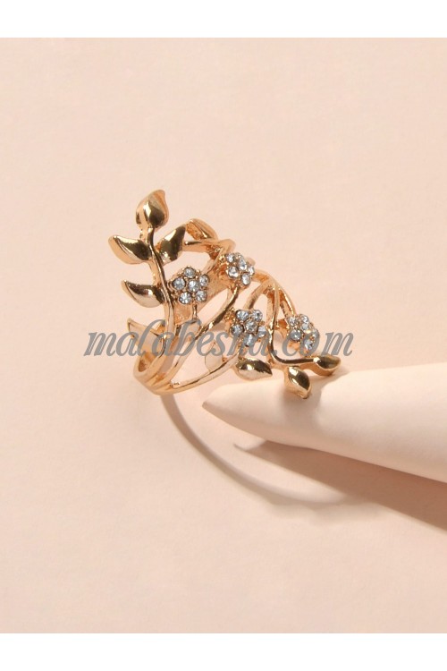 Golden ring with tree leaves