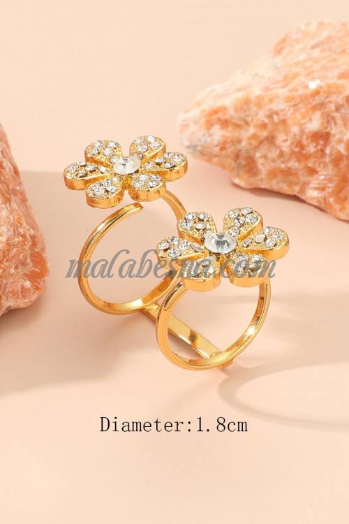 Golden ring with two flower on the ends