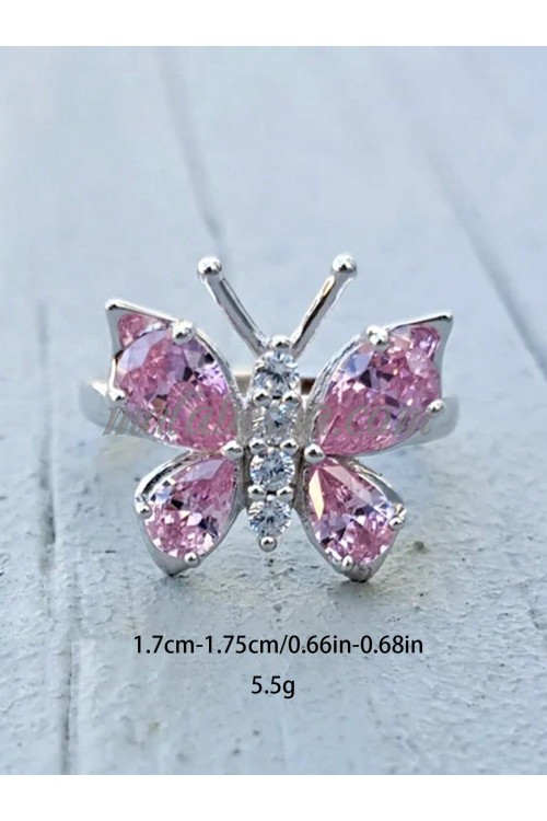 Silver ring with butterfly and pink on its wings