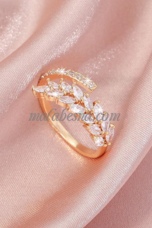 Golden color ring with white shiny stones