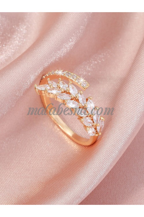 Golden color ring with white shiny stones