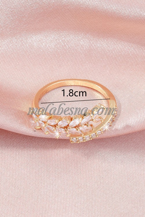 Golden color ring with white shiny stones