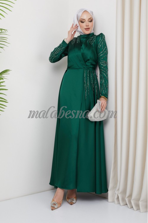 Green evening dress with attached skirt with shining stones