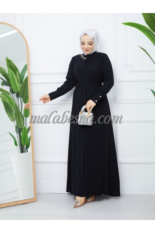 Black bleseh dress with belt and accessories attached on the dress