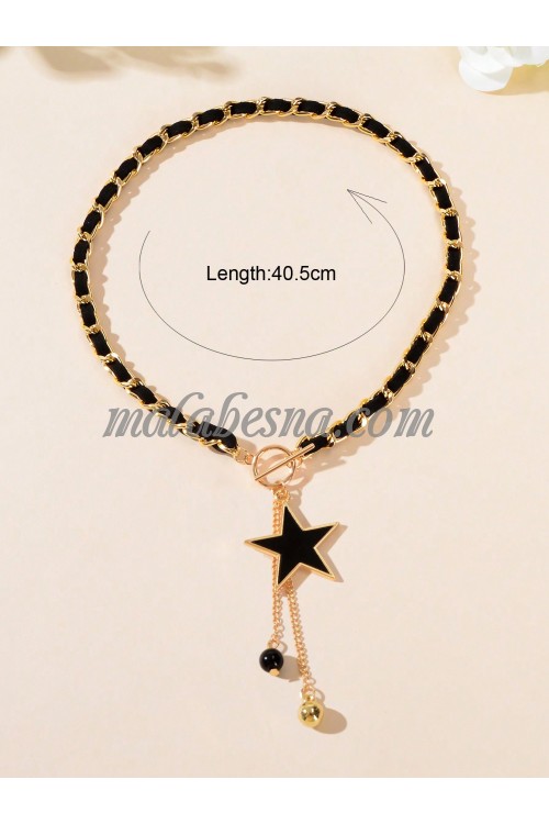 Golden necklace with black chain and star