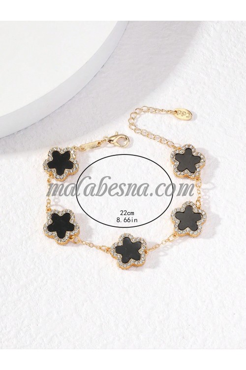 Golden bracelet with black flower and diamonds