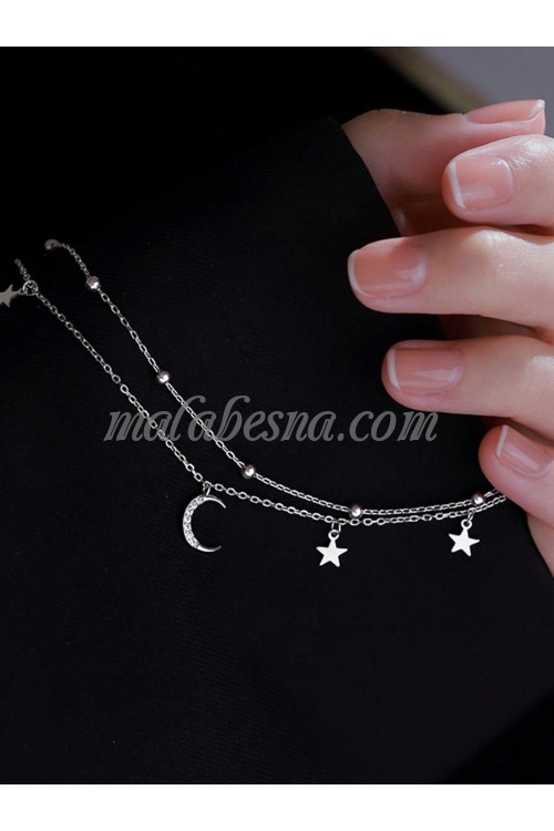 Silver bracelet with moon and stars